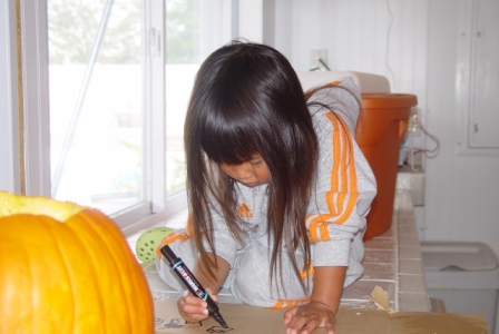 Kasen designing the pumpkin